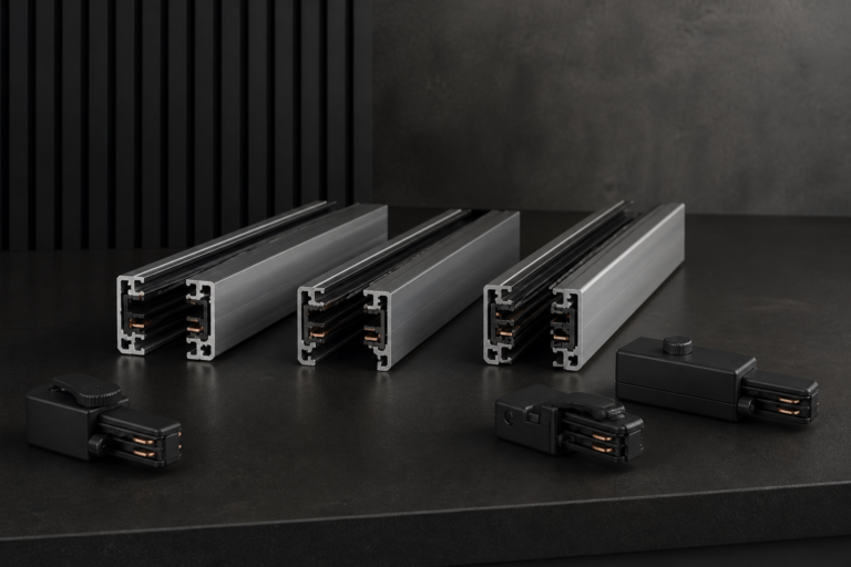 Three aluminum LED track rail sections with black adapters, representing different track rail types